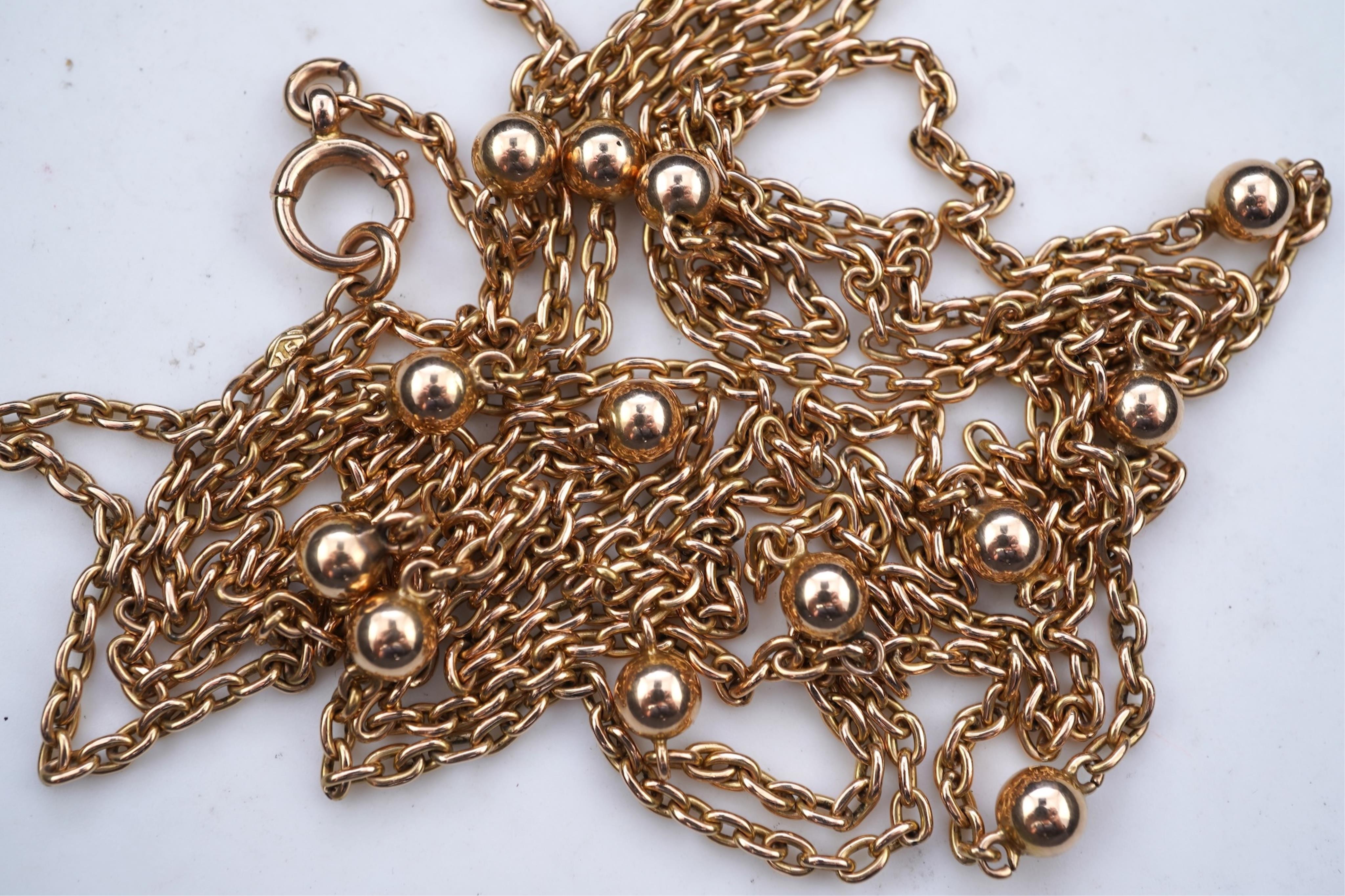 A gold long guard chain, early 20th century
